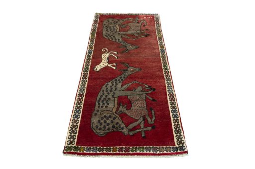 Surface texture of 2000s Persian Gabbeh rug with natural Wool and intricate pattern
