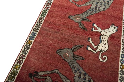 Backside of handmade 2000s Persian Gabbeh rug showing knot structure and weave density