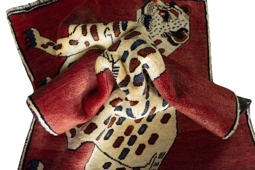 Corner detail of 2000s Persian Gabbeh rug showing border pattern and Wool pile