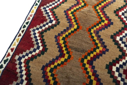 Backside of handmade 2000s Persian Gabbeh rug showing knot structure and weave density
