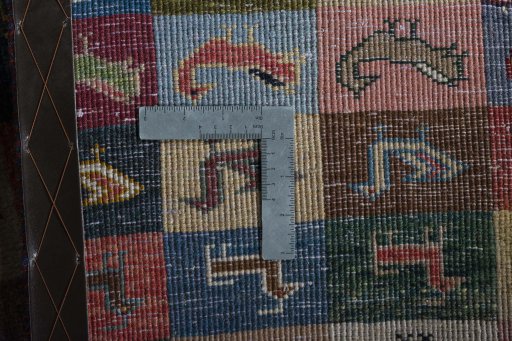 Close-up detail of 2000s Persian Gabbeh rug from Iran / Persia showing Wool weave