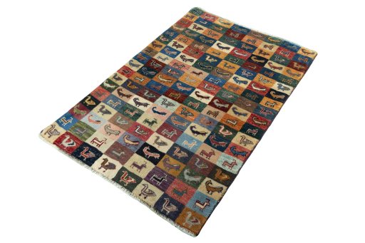 Corner detail of 2000s Persian Gabbeh rug showing border pattern and Wool pile