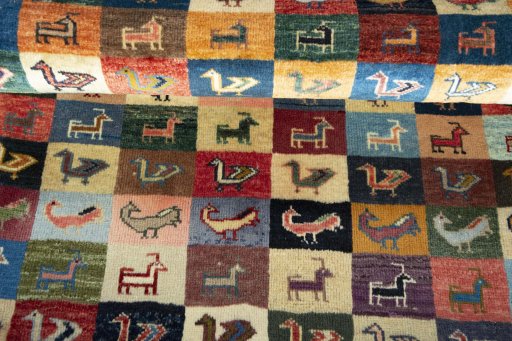 Full view of 2000s Persian Gabbeh rug from Iran / Persia, 124 × 83 cm in Multi Color tones