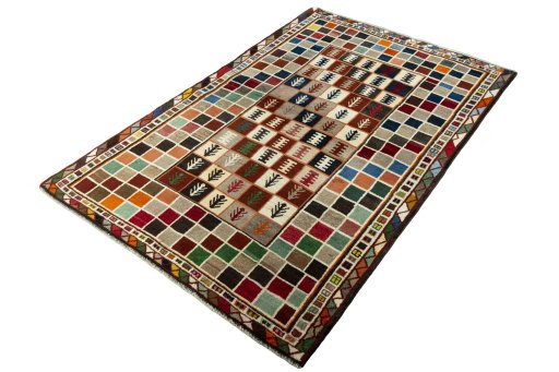 Corner detail of 2000s Persian Gabbeh rug showing border pattern and Wool pile
