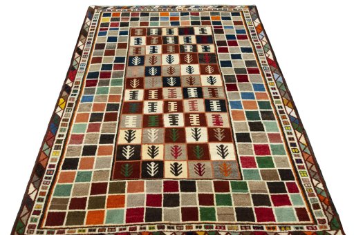 Surface texture of 2000s Persian Gabbeh rug with natural Wool and intricate pattern