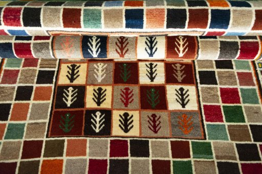 Full view of 2000s Persian Gabbeh rug from Iran / Persia, 200 × 133 cm in Multi Color tones