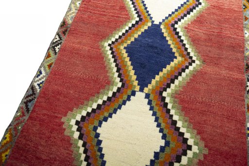 Backside of handmade 2000s Persian Gabbeh rug showing knot structure and weave density