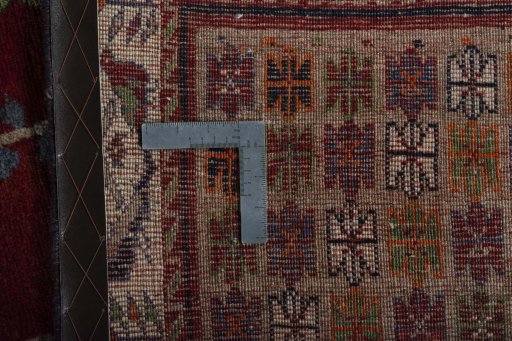 Surface texture of 2000s Persian Gabbeh rug with natural Wool and intricate pattern