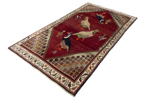 Corner detail of 2000s Persian Gabbeh rug showing border pattern and Wool pile