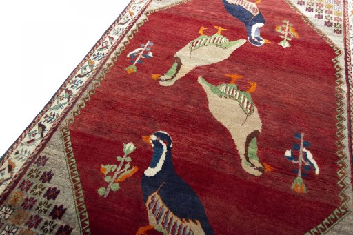 Backside of handmade 2000s Persian Gabbeh rug showing knot structure and weave density