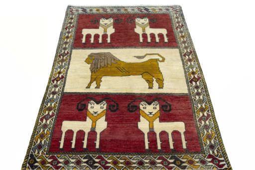 Surface texture of 2000s Persian Gabbeh rug with natural Wool and intricate pattern