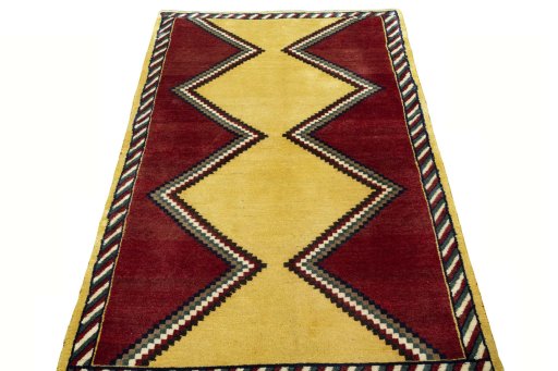 Surface texture of 2000s Persian Gabbeh rug with natural Wool and intricate pattern