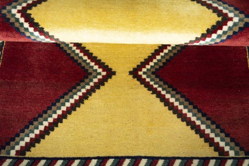 Full view of 2000s Persian Gabbeh rug from Iran / Persia, 167 × 105 cm in Red tones