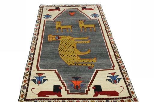 Surface texture of 2000s Persian Gabbeh rug with natural Wool and intricate pattern
