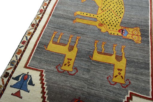 Backside of handmade 2000s Persian Gabbeh rug showing knot structure and weave density