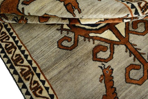 Corner detail of 2000s Persian Gabbeh rug showing border pattern and Wool pile