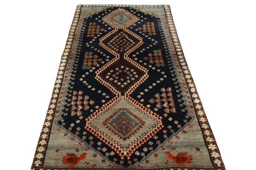 Surface texture of 2000s Persian Gabbeh rug with natural Wool and intricate pattern