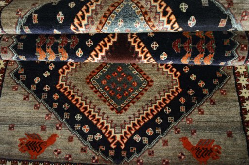 Full view of 2000s Persian Gabbeh rug from Iran / Persia, 222 × 111 cm in Blue tones