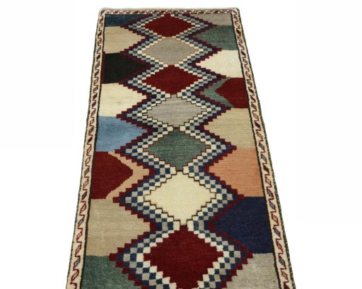 Surface texture of 2000s Persian Gabbeh rug with natural Wool and intricate pattern