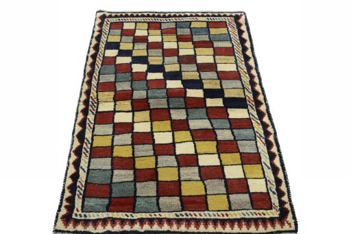 Surface texture of 2000s Persian Gabbeh rug with natural Wool and intricate pattern