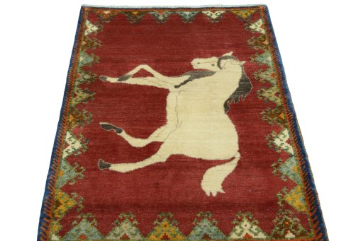 Surface texture of 2000s Persian Gabbeh rug with natural Wool and intricate pattern