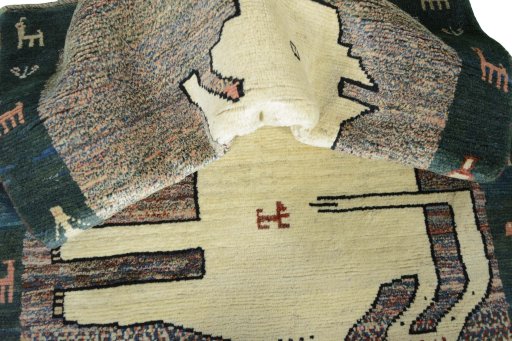 Corner detail of 2000s Persian Gabbeh rug showing border pattern and Wool pile