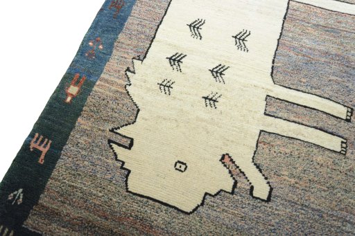 Backside of handmade 2000s Persian Gabbeh rug showing knot structure and weave density
