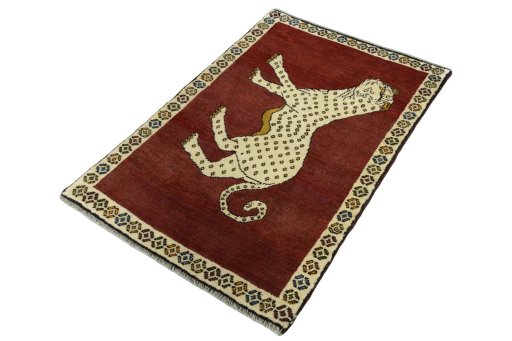 Corner detail of 2000s Persian Gabbeh rug showing border pattern and Wool pile