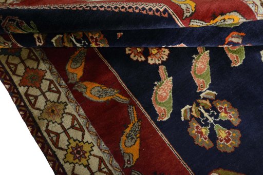 Corner detail of 2000s Persian Gabbeh rug showing border pattern and Wool pile
