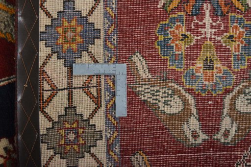 Surface texture of 2000s Persian Gabbeh rug with natural Wool and intricate pattern