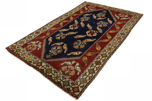 Corner detail of 2000s Persian Gabbeh rug showing border pattern and Wool pile