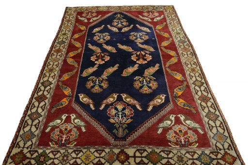 Surface texture of 2000s Persian Gabbeh rug with natural Wool and intricate pattern