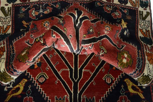 Corner detail of 2000s Persian Gabbeh rug showing border pattern and Wool pile