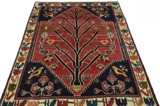 Surface texture of 2000s Persian Gabbeh rug with natural Wool and intricate pattern