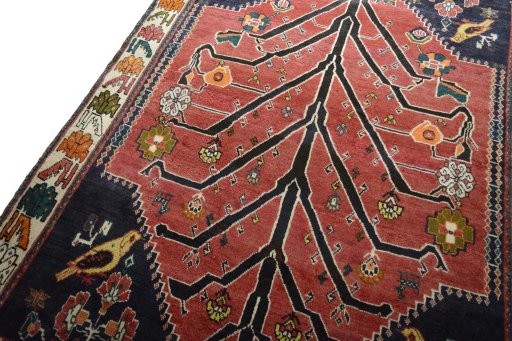 Backside of handmade 2000s Persian Gabbeh rug showing knot structure and weave density