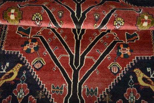 Full view of 2000s Persian Gabbeh rug from Iran / Persia, 190 × 137 cm in Red tones