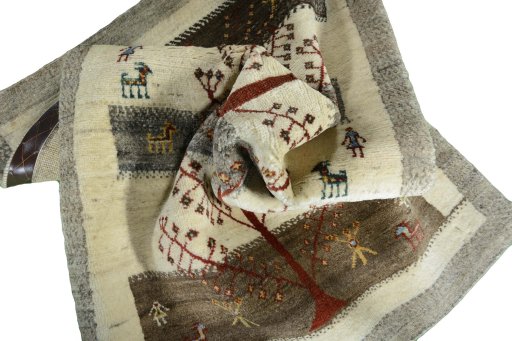Corner detail of New Persian Gabbeh rug showing border pattern and Wool pile