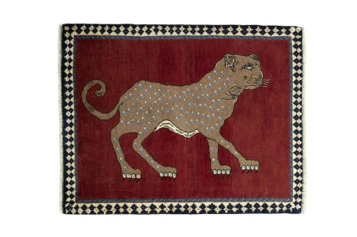 Full view of 2000s Persian Gabbeh rug from Iran / Persia, 110 × 86 cm in Red tones