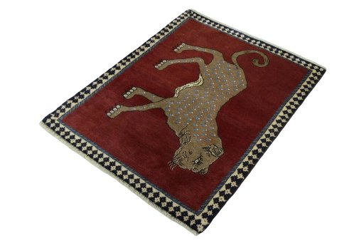 Corner detail of 2000s Persian Gabbeh rug showing border pattern and Wool pile