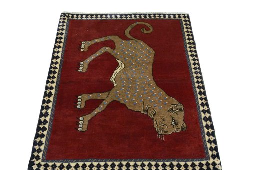 Surface texture of 2000s Persian Gabbeh rug with natural Wool and intricate pattern