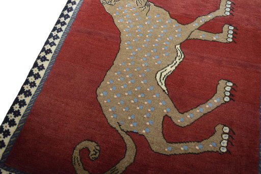 Backside of handmade 2000s Persian Gabbeh rug showing knot structure and weave density
