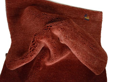 Corner detail of New Persian Gabbeh rug showing border pattern and Wool pile