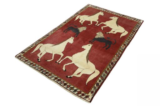 Corner detail of 2000s Persian Gabbeh rug showing border pattern and Wool pile