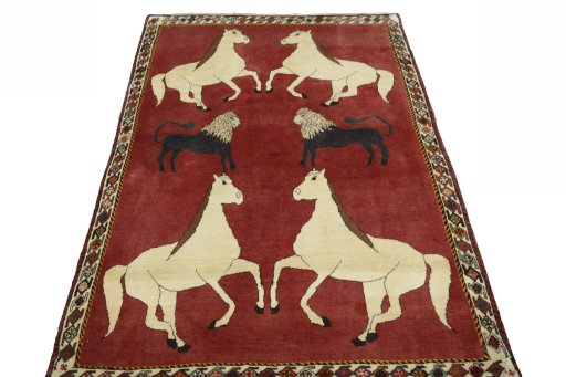 Surface texture of 2000s Persian Gabbeh rug with natural Wool and intricate pattern