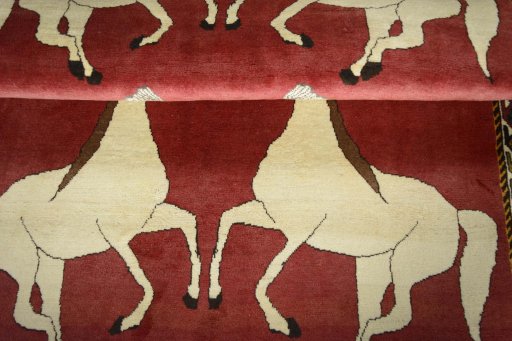 Full view of 2000s Persian Gabbeh rug from Iran / Persia, 188 × 125 cm in Red tones