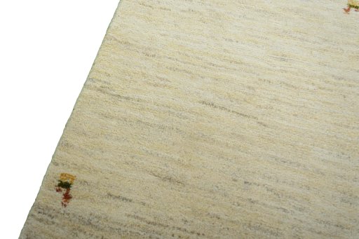 Backside of handmade New Persian Gabbeh rug showing knot structure and weave density