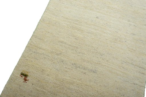 Backside of handmade New Persian Gabbeh rug showing knot structure and weave density