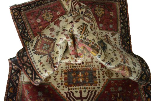 Corner detail of 2000s Persian Gabbeh rug showing border pattern and Wool pile