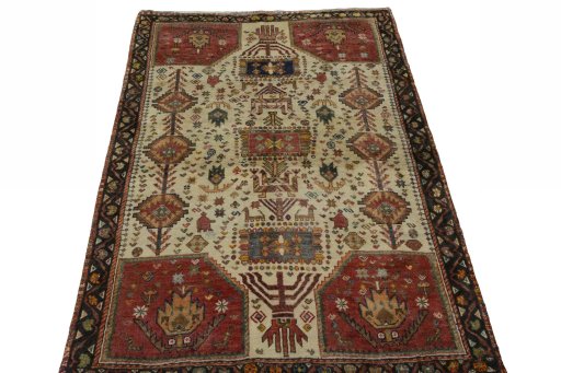Surface texture of 2000s Persian Gabbeh rug with natural Wool and intricate pattern