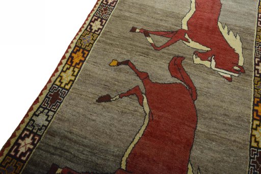 Backside of handmade 2000s Persian Gabbeh rug showing knot structure and weave density
